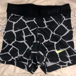 Black & gray giraffe print Nike Pros